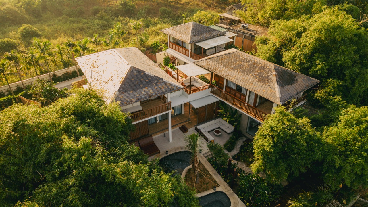 Aerial view of Oasya villa surrounded by tropical greenery